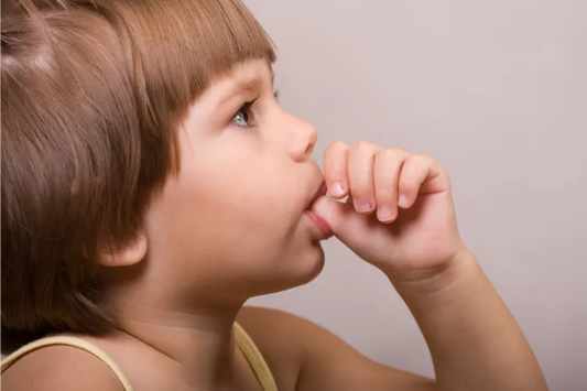 A little girl sucking her thumb 