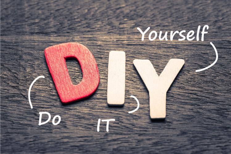 Do it yourself (DIY letters placed on a wooden background)