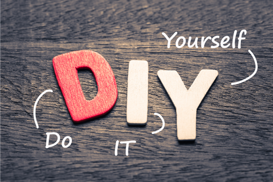 Do it yourself (DIY letters placed on a wooden background)